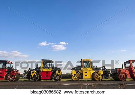 Stock Image - "Road rollers or roller-compactors for tarmacking, Gotzenhain, Dreieich, Hesse, Germany, Europe". Fotosearch