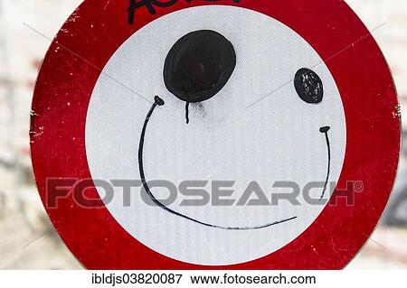 "Road sign with a painted face, Brussels, Belgium, Europe" View Large Photo Image Stock Photo - "Road sign with a painted face, Brussels, Belgium, Europe". Fotosearch