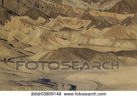 "Road through the badlands of the """"Twenty Mule Team Canyon"""" in the morning light, Death Valley, Death Valley National Park, California, USA" View Large Photo Image Stock Photo - "Road through the badlands of the """"Twenty Mule Team Canyon"""" in the morning light, Death Valley, Death Valley National Park, California, USA". Fotosearch