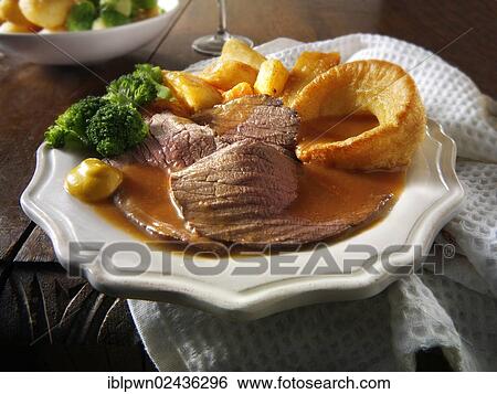 Roast beef Yorkshire pudding and gravy View Large Photo Image Stock Photograph - Roast beef Yorkshire pudding and gravy. Fotosearch