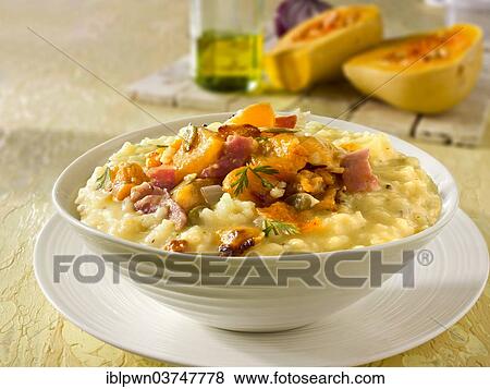 Stock Photo - Roast butternut squash on saffron risotto. Fotosearch