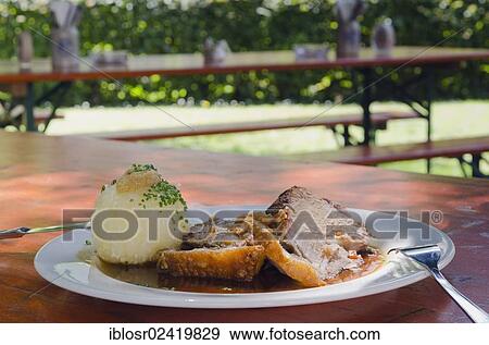 Roast pork with dumplings in a beer garden, Bavarian food, Bavaria, Germany, Europe View Large Photo Image Stock Photo - Roast pork with dumplings in a beer garden, Bavarian food, Bavaria, Germany, Europe. Fotosearch