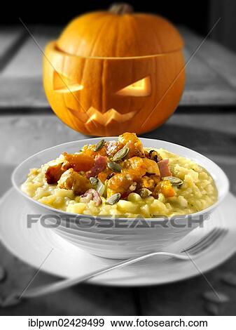Roast pumpkin and bacon on saffron risotto View Large Photo Image Stock Photo - Roast pumpkin and bacon on saffron risotto. Fotosearch