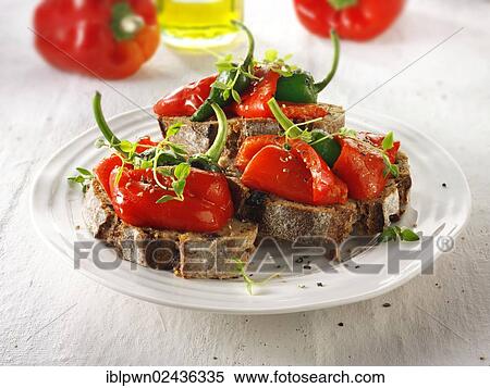 Stock Photography - "Roast red peppers with padron peppers on toasted rye bread sandwiches, bruschettas". Fotosearch