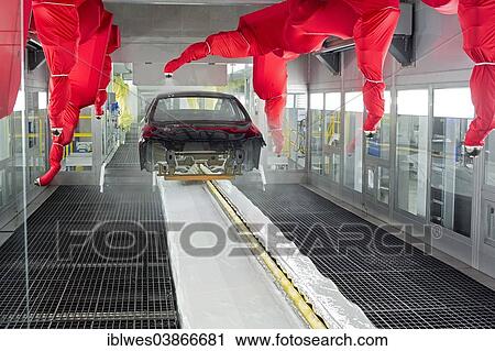 Stock Image - "Robots paint a car body in the paint shop at Chrysler's Sterling Heights Assembly Plant, where the company is making the Chrysler 200, Sterling Heights, Michigan, United States, North America". Fotosearch