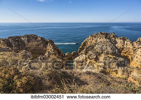 "Rock arch, Coastal landscape, rocky shore, Ponta da Piedade, Lagos, Algarve, Portugal, Europe" View Large Photo Image Stock Image - "Rock arch, Coastal landscape, rocky shore, Ponta da Piedade, Lagos, Algarve, Portugal, Europe". Fotosearch