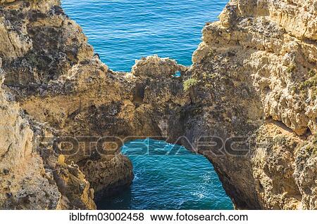 "Rock arch, coastal landscape, rocky shore, Ponta da Piedade, Lagos, Algarve, Portugal, Europe" View Large Photo Image Stock Photo - "Rock arch, coastal landscape, rocky shore, Ponta da Piedade, Lagos, Algarve, Portugal, Europe". Fotosearch