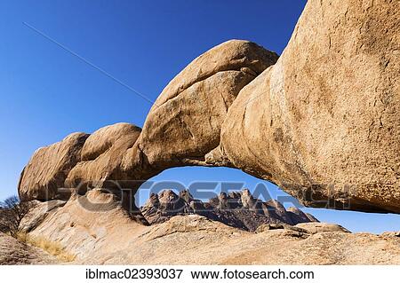 "Rock arch, Pontok Mountains at the back, near the Spitzkoppe granite peaks, Damaraland, Namibia, Africa" View Large Photo Image Stock Photo - "Rock arch, Pontok Mountains at the back, near the Spitzkoppe granite peaks, Damaraland, Namibia, Africa". Fotosearch