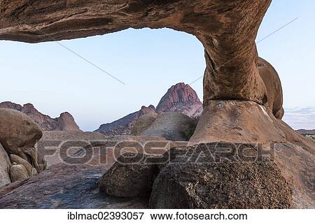 "Rock arch, Spitzkoppe granite peaks at the back, Damaraland, Namibia, Africa" View Large Photo Image Stock Photo - "Rock arch, Spitzkoppe granite peaks at the back, Damaraland, Namibia, Africa". Fotosearch