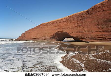 "Rock bridge on the beach of Legzira on the Atlantic Ocean, near Sidi Ifni, Morocco, Africa" View Large Photo Image Picture - "Rock bridge on the beach of Legzira on the Atlantic Ocean, near Sidi Ifni, Morocco, Africa". Fotosearch