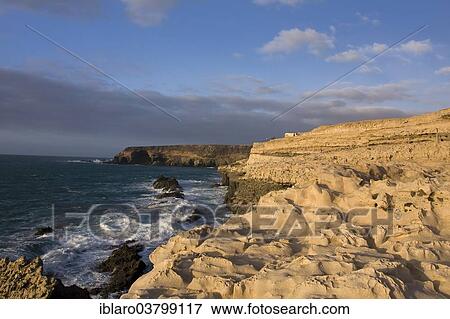 "Rock formations, limestone rocks on the cliffs near the fishing village of Ajuy, Fuerteventura, Canary Islands, Spain, Europe" View Large Photo Image Stock Photo - "Rock formations, limestone rocks on the cliffs near the fishing village of Ajuy, Fuerteventura, Canary Islands, Spain, Europe". Fotosearch