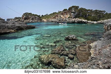 "Rock-lined bay of Calo des Moro, Santanyi, Mallorca, Majorca, Balearic Islands, Spain, Europe" View Large Photo Image Stock Photo - "Rock-lined bay of Calo des Moro, Santanyi, Mallorca, Majorca, Balearic Islands, Spain, Europe". Fotosearch
