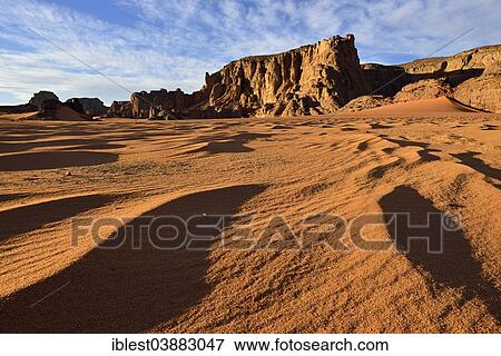 "Rock towers and sand dunes at Tamezguida, Tadrart region, Tassili n’Ajjer National Park, Unesco World Heritage Site, Sahara, Algeria, Africa" View Large Photo Image Stock Photo - "Rock towers and sand dunes at Tamezguida, Tadrart region, Tassili n’Ajjer National Park, Unesco World Heritage Site, Sahara, Algeria, Africa". Fotosearch