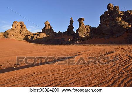 "Rock towers and sand dunes at the Cirque, Tadrart region, Tassili n'Ajjer National Park, Unesco World Heritage Site, Algeria, Sahara, North Africa, Africa" View Large Photo Image Stock Image - "Rock towers and sand dunes at the Cirque, Tadrart region, Tassili n'Ajjer National Park, Unesco World Heritage Site, Algeria, Sahara, North Africa, Africa". Fotosearch