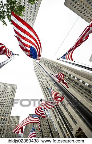 "Rockefeller Center with U. S. American flags, worm's-eye view, Manhattan, New York, USA" View Large Photo Image Stock Photo - "Rockefeller Center with U. S. American flags, worm's-eye view, Manhattan, New York, USA". Fotosearch