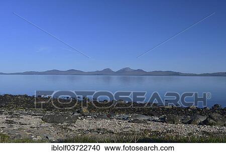 "Rocks on the beach, island of Jura at back, from Millers Bay, Knapdale, Scotland, United Kingdom, Europe" View Large Photo Image Stock Image - "Rocks on the beach, island of Jura at back, from Millers Bay, Knapdale, Scotland, United Kingdom, Europe". Fotosearch