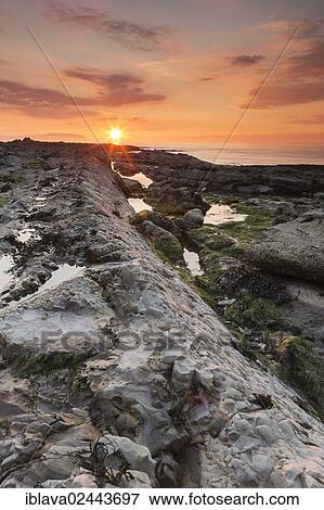 "Rocky beach of Watchet, sunset, Somerset Coast, England, United Kingdom, Europe" View Large Photo Image Stock Photo - "Rocky beach of Watchet, sunset, Somerset Coast, England, United Kingdom, Europe". Fotosearch