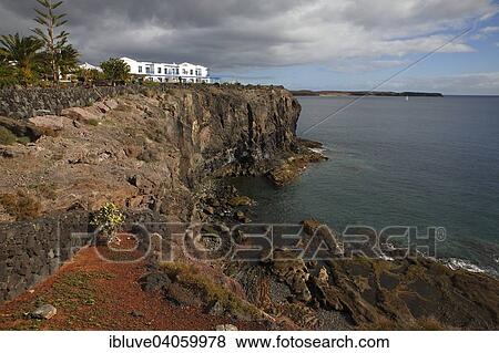 Stock Photo - "Rocky coast on the Paseo Maritimo beach promenade, Las Coloradas, Playa Blanca, Lanzarote, Canary Islands, Spain, Europe". Fotosearch