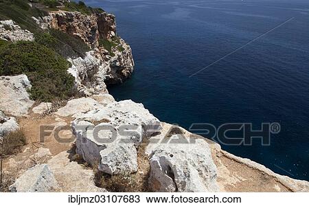 "Rocky coastline near Es Pontas, Santanyi, Mallorca, Majorca, Balearic Islands, Spain, Europe" View Large Photo Image Stock Image - "Rocky coastline near Es Pontas, Santanyi, Mallorca, Majorca, Balearic Islands, Spain, Europe". Fotosearch