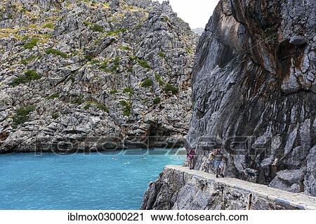 "Rocky path to the hidden Bay of Sa Calobra, Cala de Sa Calobra Bucht, Sa Calobra, Serra de Tramuntana, Majorca, Balearic Islands, Spain, Europe" View Large Photo Image Stock Image - "Rocky path to the hidden Bay of Sa Calobra, Cala de Sa Calobra Bucht, Sa Calobra, Serra de Tramuntana, Majorca, Balearic Islands, Spain, Europe". Fotosearch