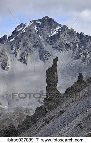 Stock Photo - "Rocky pinnacle before Piz Foraz, border to the Swiss National Park, Lower Engadine, Canton of Grisons, Switzerland, Europe". Fotosearch