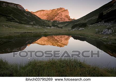 "Rofanspitze peak at dawn reflected in Zireiner See, Rofan Mountains, Tyrol, Austria, Europe" View Large Photo Image Stock Photo - "Rofanspitze peak at dawn reflected in Zireiner See, Rofan Mountains, Tyrol, Austria, Europe". Fotosearch