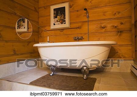 "Roll top bath in a bathroom inside a Canadiana cottage, a white pine log home, Quebec Province, Canada, North America" View Large Photo Image Stock Image - "Roll top bath in a bathroom inside a Canadiana cottage, a white pine log home, Quebec Province, Canada, North America". Fotosearch