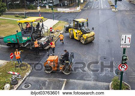 "Rolling machines and an asphalt spreader, urban road construction site, Essen, North Rhine-Westphalia, Germany, Europe" View Large Photo Image Stock Image - "Rolling machines and an asphalt spreader, urban road construction site, Essen, North Rhine-Westphalia, Germany, Europe". Fotosearch