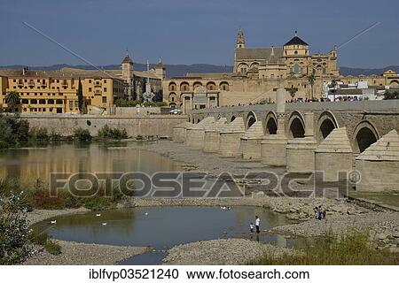 "Roman bridge, Puente Viejo, over the Guadalquivir river, Mosque–Cathedral of Cordoba or Mezquita at back, Cordoba, Cordoba province, Andalusia, Spain, Europe" View Large Photo Image Stock Image - "Roman bridge, Puente Viejo, over the Guadalquivir river, Mosque–Cathedral of Cordoba or Mezquita at back, Cordoba, Cordoba province, Andalusia, Spain, Europe". Fotosearch
