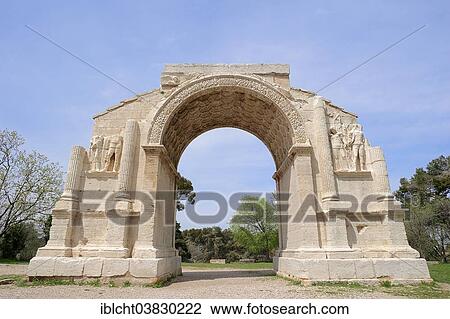 Stock Image - "Roman Triumphal Arch, Glanum, Saint Remy-de-Provence, Bouches-du-Rhone, Provence-Alpes-Cote d'Azur, Southern France, France, Europe". Fotosearch