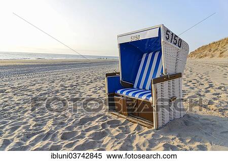 "Roofed wicker beach chair on the beach, Rantum, Rantum, Sylt, North Frisian Islands, Schleswig-Holstein, Germany, Europe" View Large Photo Image Stock Photography - "Roofed wicker beach chair on the beach, Rantum, Rantum, Sylt, North Frisian Islands, Schleswig-Holstein, Germany, Europe". Fotosearch