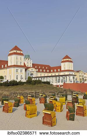 "Roofed wicker beach chairs in front of the Kurhaus spa hotel of the Baltic Sea resort town of Binz, with copy space, Ruegen, Mecklenburg-Western Pomerania, Germany, Europe" View Large Photo Image Stock Image - "Roofed wicker beach chairs in front of the Kurhaus spa hotel of the Baltic Sea resort town of Binz, with copy space, Ruegen, Mecklenburg-Western Pomerania, Germany, Europe". Fotosearch