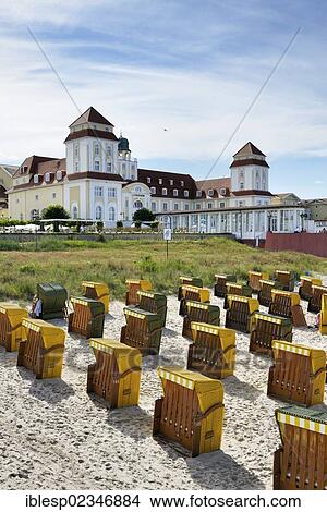 Picture - "Roofed wicker beach chairs on the beach in front of the Kurhaus spa building, Binz, Mecklenburg-Western Pomerania, Germany, Europe". Fotosearch