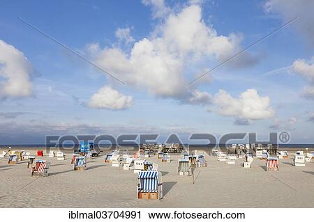 "Roofed wicker beach chairs on the beach, St. Peter-Ording, Eiderstedt, North Frisia, Schleswig-Holstein, Germany, Europe" View Large Photo Image Stock Image - "Roofed wicker beach chairs on the beach, St. Peter-Ording, Eiderstedt, North Frisia, Schleswig-Holstein, Germany, Europe". Fotosearch