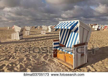 "Roofed wicker beach chairs on the beach, St. Peter-Ording, Eiderstedt, North Frisia, Schleswig-Holstein, Germany, Europe" View Large Photo Image Stock Image - "Roofed wicker beach chairs on the beach, St. Peter-Ording, Eiderstedt, North Frisia, Schleswig-Holstein, Germany, Europe". Fotosearch