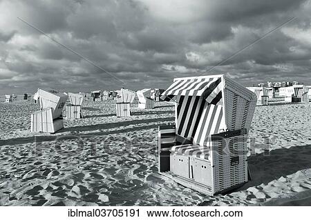 "Roofed wicker beach chairs on the beach, St. Peter-Ording, Eiderstedt, North Frisia, Schleswig-Holstein, Germany, Europe" View Large Photo Image Stock Image - "Roofed wicker beach chairs on the beach, St. Peter-Ording, Eiderstedt, North Frisia, Schleswig-Holstein, Germany, Europe". Fotosearch