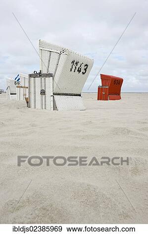 "Roofed wicker beach chairs on the beach of St. Peter-Ording, North Frisia, Schleswig-Holstein, Germany, Europe" View Large Photo Image Stock Photo - "Roofed wicker beach chairs on the beach of St. Peter-Ording, North Frisia, Schleswig-Holstein, Germany, Europe". Fotosearch