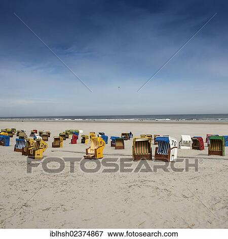 "Roofed wicker beach chairs on the beach of Juist island, North Sea, Lower Saxony Wadden Sea, East Frisia, Lower Saxony, Germany, Europe" View Large Photo Image Stock Photo - "Roofed wicker beach chairs on the beach of Juist island, North Sea, Lower Saxony Wadden Sea, East Frisia, Lower Saxony, Germany, Europe". Fotosearch