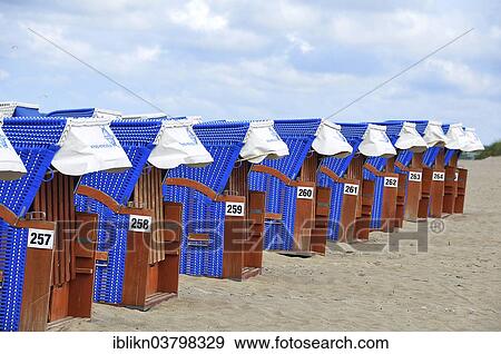 Stock Photo - "Roofed wicker beach chairs on the beach, Warnemunde, Mecklenburg-Vorpommern, Germany, Europe". Fotosearch