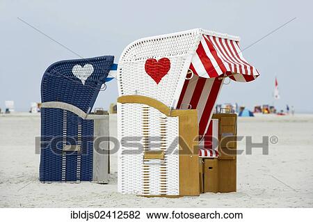 Roofed wicker beach chairs with hearts, Kniepsand at Norddorf, Amrum, North Frisia, Schleswig-Holstein, Germany, Europe View Large Photo Image Stock Image - Roofed wicker beach chairs with hearts, Kniepsand at Norddorf, Amrum, North Frisia, Schleswig-Holstein, Germany, Europe. Fotosearch