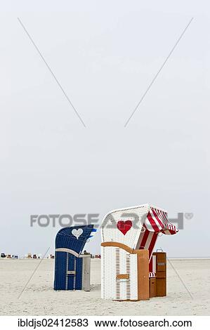 Roofed wicker beach chairs with hearts, Kniepsand at Norddorf, Amrum, North Frisia, Schleswig-Holstein, Germany, Europe View Large Photo Image Stock Image - Roofed wicker beach chairs with hearts, Kniepsand at Norddorf, Amrum, North Frisia, Schleswig-Holstein, Germany, Europe. Fotosearch