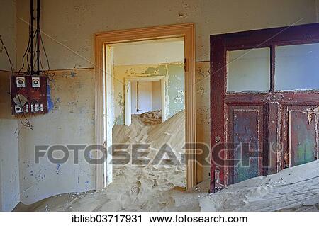 Stock Image - "Room in a house that has been filled by desert sand, in the former diamond city of Kolmanskuppe, now a ghost town, Kolmanskop, Karas Region, Namibia, Africa". Fotosearch