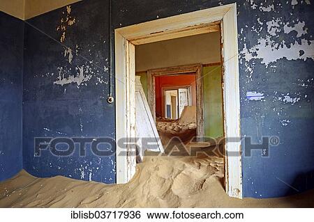 Stock Photograph - "Room in a house that has been filled by desert sand, in the former diamond city of Kolmanskuppe, now a ghost town, Kolmanskop, Karas Region, Namibia, Africa". Fotosearch