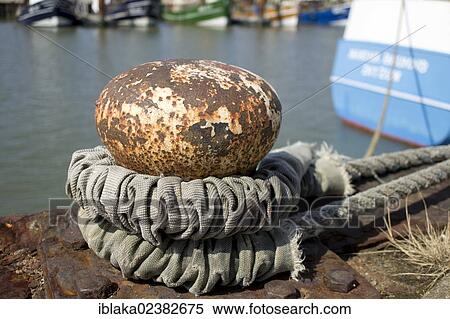 "Rope around a bollard in the port, Norddeich, Norden, East Frisia, Lower Saxony, Germany, Europe" View Large Photo Image Stock Photography - "Rope around a bollard in the port, Norddeich, Norden, East Frisia, Lower Saxony, Germany, Europe". Fotosearch