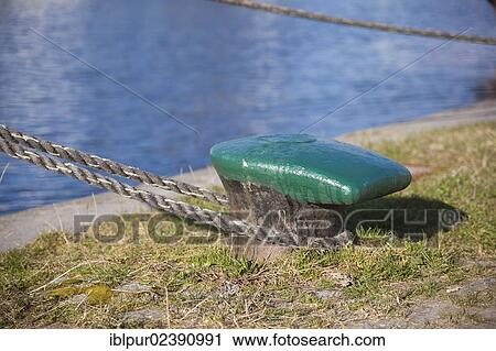 "Rope tied around a bollard, moored securely, in the harbour of Greifswald, Mecklenburg-Western Pomerania, Germany, Europe" View Large Photo Image Stock Image - "Rope tied around a bollard, moored securely, in the harbour of Greifswald, Mecklenburg-Western Pomerania, Germany, Europe". Fotosearch