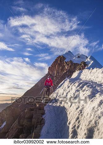 Stock Image - "Roped alpinist on the mountain ridge, Huayna Potosi, Cordillera Real, Bolivia, South America". Fotosearch