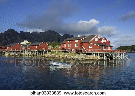"Rorbuer fishermen's cabins with a small motor boat, Henningsvaer, Lofoten, Nordland, Norway, Europe" View Large Photo Image Stock Photo - "Rorbuer fishermen's cabins with a small motor boat, Henningsvaer, Lofoten, Nordland, Norway, Europe". Fotosearch