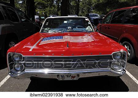 Stock Photo - "Roter Plymouth Fury 67 with U. S. flat on the hood, vintage car, Grand Canyon Lodge, Grand Canyon National Park, North Rim, Arizona, USA". Fotosearch