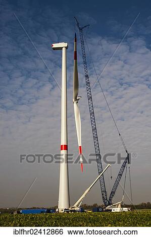 Stock Photograph - Rotor blades suspended from a crane, Grevenbroich, North Rhine-Westphalia, Germany, Europe. Fotosearch