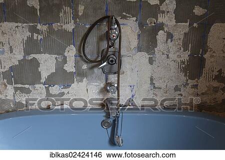 Rotted bathtub fittings above tub, removed tiles, old bathroom, old bathtub, bathroom renovation View Large Photo Image Stock Photograph - Rotted bathtub fittings above tub, removed tiles, old bathroom, old bathtub, bathroom renovation. Fotosearch